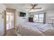 Comfortable bedroom with a large window and ceiling fan at 2595 Amber Crest St, Las Vegas, NV 89142