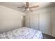 Bedroom offers carpeted floors and a large closet with white sliding doors at 2595 Amber Crest St, Las Vegas, NV 89142