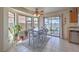 Bright dining area featuring tile flooring, large windows, and easy access to the outdoor patio at 2595 Amber Crest St, Las Vegas, NV 89142