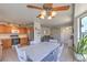 Combined dining and kitchen area, with oak cabinets and stainless steel appliances at 2595 Amber Crest St, Las Vegas, NV 89142