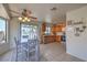 Eat in kitchen featuring stainless steel appliances, wood cabinets and sliding door access to backyard at 2595 Amber Crest St, Las Vegas, NV 89142