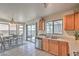 Eat-in kitchen with stainless steel appliances, wooden cabinets and sliding doors leading to backyard at 2595 Amber Crest St, Las Vegas, NV 89142
