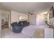 Open-concept living area with a ceiling fan, neutral tones, and tile floors at 2595 Amber Crest St, Las Vegas, NV 89142