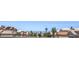 Distant cityscape view of houses with tile roofs and solar panels at 2595 Amber Crest St, Las Vegas, NV 89142