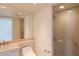 Bathroom features a sink with a mirrored wall and glass-enclosed shower at 2777 Paradise Rd # 1505, Las Vegas, NV 89109