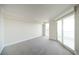 Spacious bedroom with neutral carpet and large sliding glass doors to balcony at 2777 Paradise Rd # 1505, Las Vegas, NV 89109