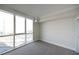 Bright bedroom has neutral carpet, large windows with a view, and white trim at 2777 Paradise Rd # 1505, Las Vegas, NV 89109