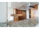 Well-equipped kitchen with granite countertops, wood cabinetry, and modern stainless steel appliances at 2777 Paradise Rd # 1505, Las Vegas, NV 89109