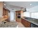 Gourmet kitchen features granite countertops, wood cabinets, and stainless steel appliances at 2777 Paradise Rd # 1505, Las Vegas, NV 89109