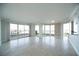 Bright and airy living room with tile floors, large windows, and sliding doors to a balcony at 2777 Paradise Rd # 1505, Las Vegas, NV 89109