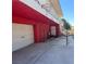 Exterior features a garage and stairs leading to the upper level, and a basketball hoop ready for play at 2855 Rice St, Logandale, NV 89021