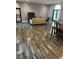 Spacious living room with hardwood flooring, large windows, and neutral paint tones, creating an inviting atmosphere at 2855 Rice St, Logandale, NV 89021