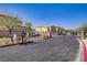 Gated entrance to a residential community featuring desert landscaping, controlled access, and well-maintained streets at 320 Point Loma Ave, North Las Vegas, NV 89031