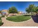 Neighborhood park with manicured lawn, walking path, picnic pavilions, playground, and desert landscaping at 320 Point Loma Ave, North Las Vegas, NV 89031