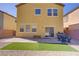 Well-maintained backyard with grass, patio, and drought-resistant landscaping perfect for outdoor enjoyment at 320 Point Loma Ave, North Las Vegas, NV 89031