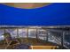 Balcony seating with a panoramic night view of the city lights and distant mountains at 322 Karen Ave # 2807, Las Vegas, NV 89109