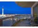 Balcony space with seating that provides spectacular nighttime views of the Stratosphere and the city skyline at 322 Karen Ave # 2807, Las Vegas, NV 89109