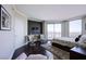 Relaxing bedroom with hardwood flooring and a large window with views of the city at 322 Karen Ave # 2807, Las Vegas, NV 89109