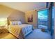 Inviting bedroom showcasing a cityscape view, plush carpet, and neutral color scheme at 322 Karen Ave # 2807, Las Vegas, NV 89109