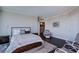 Comfortable bedroom with large bed, soft rug and seating area at 322 Karen Ave # 2807, Las Vegas, NV 89109