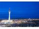 Night view of the lit-up Stratosphere Tower and surrounding Las Vegas cityscape against a dark blue sky at 322 Karen Ave # 2807, Las Vegas, NV 89109