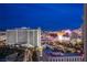Elevated nighttime cityscape featuring iconic hotels and casinos against the backdrop of a dark blue sky at 322 Karen Ave # 2807, Las Vegas, NV 89109