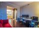 Open home office features a modern desk, multiple monitors, and comfortable seating at 322 Karen Ave # 2807, Las Vegas, NV 89109