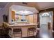 A well-lit kitchen features wooden cabinetry and a granite island, perfect for entertaining at 322 Karen Ave # 2807, Las Vegas, NV 89109