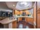 A modern kitchen features stainless steel appliances, wood cabinets, and granite countertops at 322 Karen Ave # 2807, Las Vegas, NV 89109