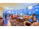 Spacious living room with city views, comfortable seating, a shag rug, and modern lighting fixtures at 322 Karen Ave # 2807, Las Vegas, NV 89109