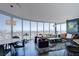 The combined living and dining areas feature panoramic views and stylish contemporary furnishings at 322 Karen Ave # 2807, Las Vegas, NV 89109