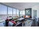 A contemporary living room with floor-to-ceiling windows showcases expansive city views at 322 Karen Ave # 2807, Las Vegas, NV 89109