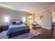 Bright main bedroom with dark wood floors, neutral decor, and ensuite access at 322 Karen Ave # 2807, Las Vegas, NV 89109