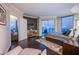 A serene main bedroom offers city views, a plush bed, and stylish furnishings at 322 Karen Ave # 2807, Las Vegas, NV 89109