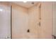 Tiled shower with a built-in bench and recessed shelf at 322 Karen Ave # 2807, Las Vegas, NV 89109
