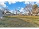Expansive grassy common area with scattered trees and parking visible on a sunny day at 3318 N Decatur Blvd # 1035, Las Vegas, NV 89130