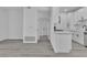 Kitchen view featuring an island, white cabinets, and appliances at 3318 N Decatur Blvd # 1035, Las Vegas, NV 89130