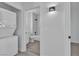 Convenient laundry room with stacked washer and dryer, plus bathroom access at 3318 N Decatur Blvd # 1035, Las Vegas, NV 89130