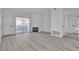 Bright living room featuring light wood flooring, a fireplace, and sliding glass doors that lead to an outdoor area at 3318 N Decatur Blvd # 1035, Las Vegas, NV 89130