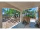 Relaxing backyard patio with a covered area, perfect for outdoor entertaining at 4487 Tomer Ln, Las Vegas, NV 89121