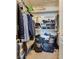 Functional walk-in closet with shelving, hanging rods, and ample storage space for clothes and luggage at 4487 Tomer Ln, Las Vegas, NV 89121
