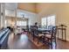 Elegant dining room with hardwood floors and large windows, ideal for gatherings at 4487 Tomer Ln, Las Vegas, NV 89121