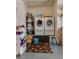 Bright laundry room with washer, dryer, water heater, and storage, perfect for convenience and organization at 4487 Tomer Ln, Las Vegas, NV 89121
