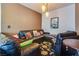 Cozy living room with a plush sectional sofa and stylish decor at 4487 Tomer Ln, Las Vegas, NV 89121