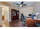 Charming office featuring wood floors, ceiling fan, and a bookshelf, providing a functional and stylish workspace at 4487 Tomer Ln, Las Vegas, NV 89121