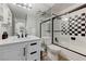 Bright bathroom featuring a glass shower with modern fixtures and tiled shower at 450 Intrepid Ct, Boulder City, NV 89005