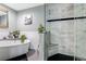 Bathroom featuring modern tile, a standalone tub, and a glass-enclosed shower at 450 Intrepid Ct, Boulder City, NV 89005