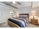 Comfortable bedroom showcasing a ceiling fan and wood-look details and a clock at 450 Intrepid Ct, Boulder City, NV 89005