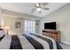 Bedroom featuring a modern ceiling fan, wooden furniture, and window shutters at 450 Intrepid Ct, Boulder City, NV 89005