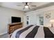 Bedroom featuring a modern ceiling fan, wooden furniture, and a TV at 450 Intrepid Ct, Boulder City, NV 89005